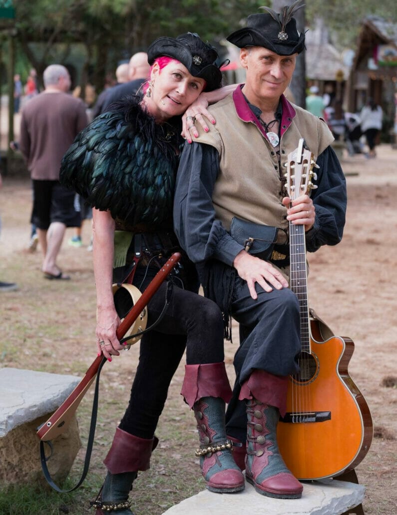 A pair of custom-designed leather boots displayed at a Renaissance Faire.